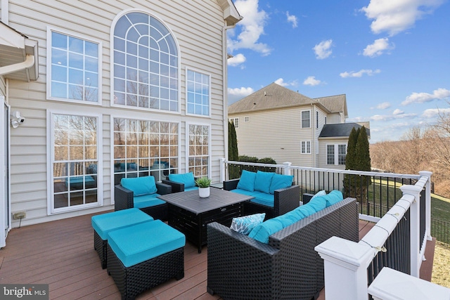 wooden deck featuring an outdoor living space