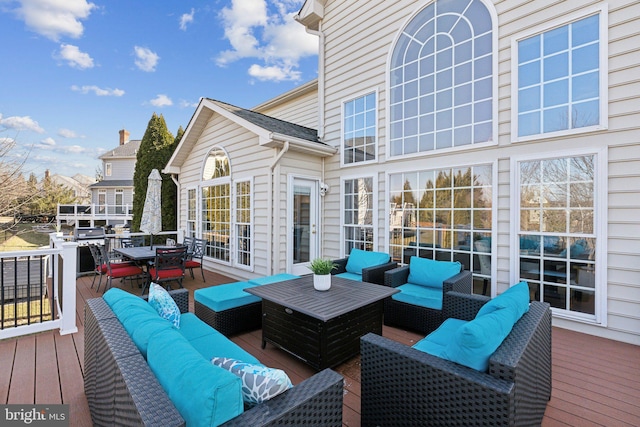 wooden deck featuring outdoor dining area and outdoor lounge area