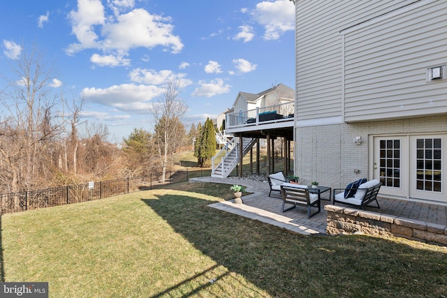 view of yard with a fenced backyard, french doors, stairway, a wooden deck, and a patio area