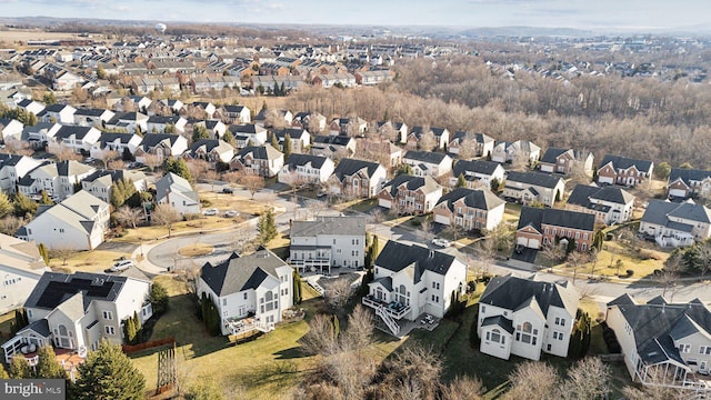 birds eye view of property with a residential view