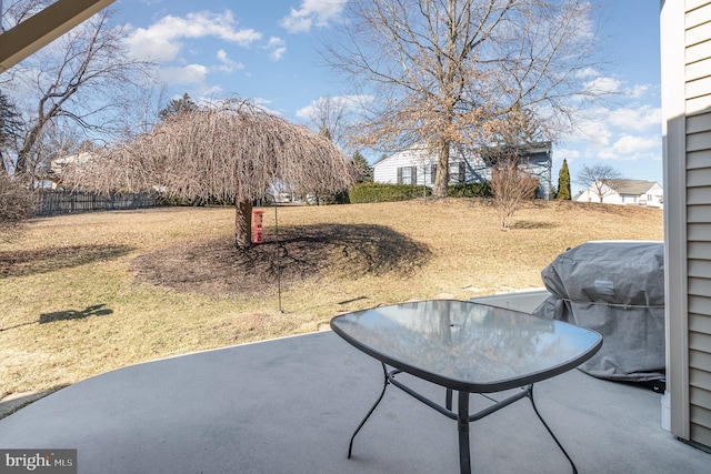 view of patio with fence and area for grilling