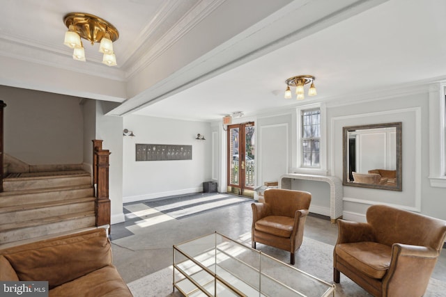 interior space featuring finished concrete flooring, baseboards, ornamental molding, stairs, and a chandelier