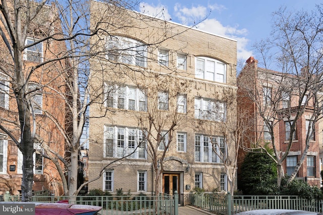 view of property featuring a fenced front yard