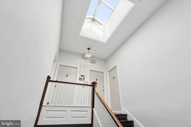 staircase with a skylight