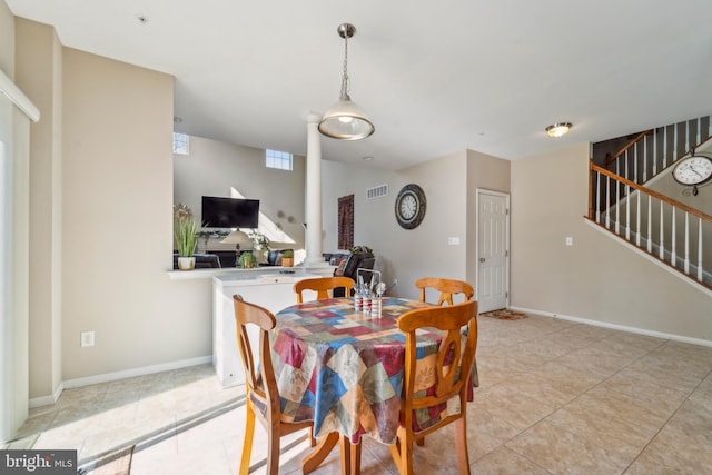 dining area featuring visible vents, stairway, baseboards, and light tile patterned flooring