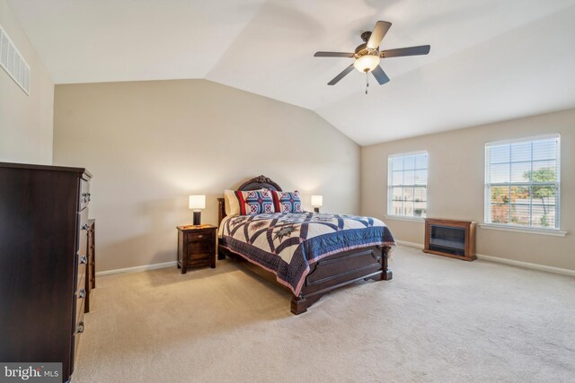 bedroom featuring vaulted ceiling, visible vents, and baseboards