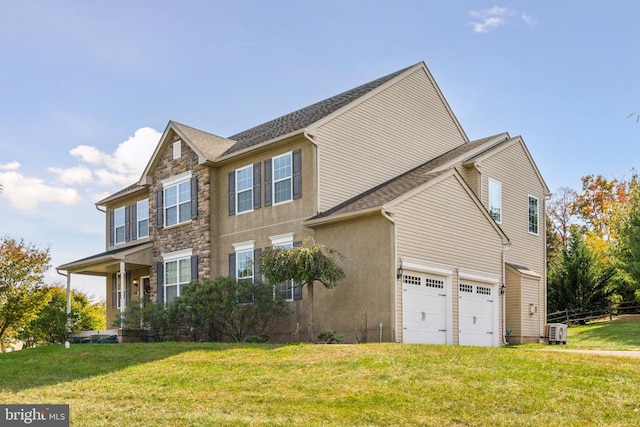 view of front of home with stone siding, an attached garage, and a front lawn