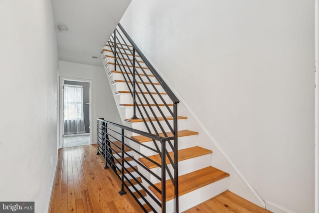 stairway with wood finished floors