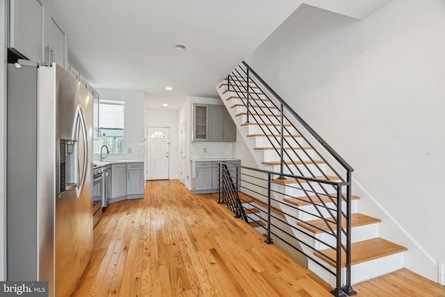 interior space with wood finished floors and recessed lighting