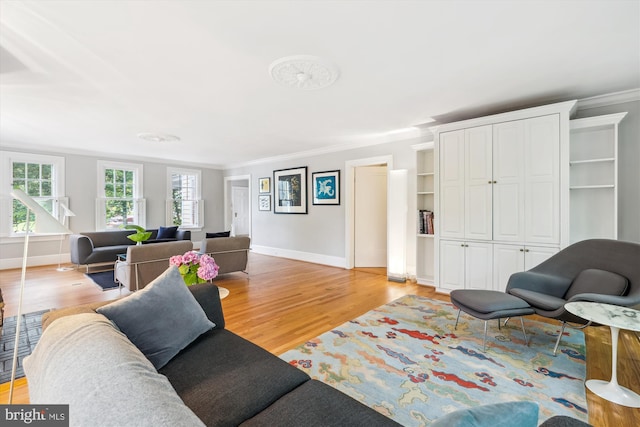 300 E Broad St, Falls Church, VA 22046 - living room featuring light wood finished floors and crown molding