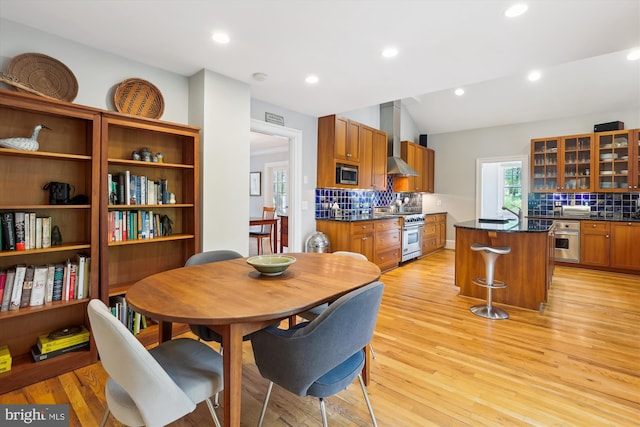 300 E Broad St, Falls Church, VA 22046 - dining space featuring light wood-style floors, vaulted ceiling, and recessed lighting