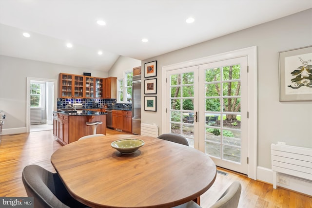 300 E Broad St, Falls Church, VA 22046 - dining space with healthy amount of natural light, recessed lighting, light wood finished floors, and vaulted ceiling