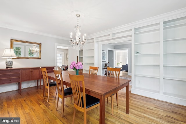 300 E Broad St, Falls Church, VA 22046 - dining room with a chandelier, built in features, crown molding, and light wood-style floors