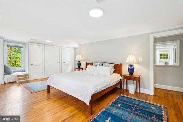300 E Broad St, Falls Church, VA 22046 - bedroom with wood finished floors and baseboards