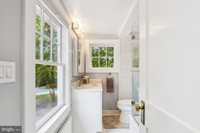 300 E Broad St, Falls Church, VA 22046 - full bath featuring healthy amount of natural light, vanity, tile patterned floors, and a shower