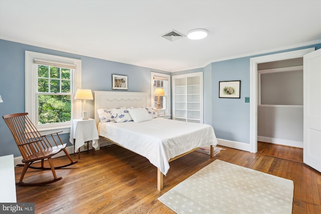 300 E Broad St, Falls Church, VA 22046 - bedroom with hardwood / wood-style floors and crown molding