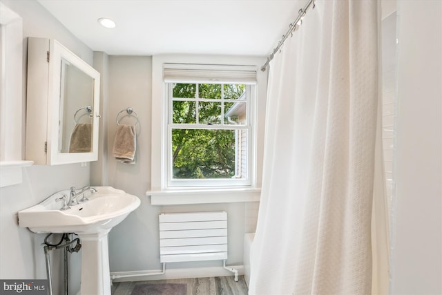 300 E Broad St, Falls Church, VA 22046 - bathroom with shower / tub combo and wood finished floors