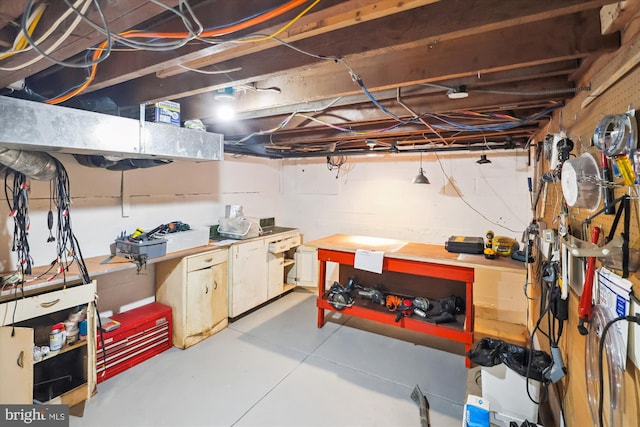 300 E Broad St, Falls Church, VA 22046 - unfinished below grade area featuring a workshop area