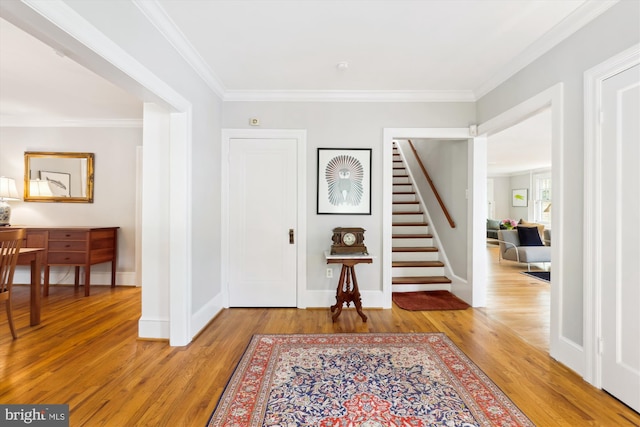 300 E Broad St, Falls Church, VA 22046 - entrance foyer with wood finished floors, stairway, and crown molding