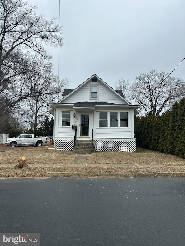 bungalow-style home featuring entry steps