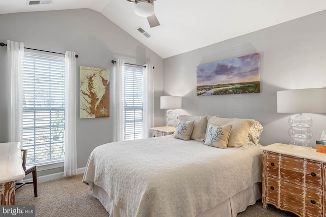 carpeted bedroom featuring vaulted ceiling, ceiling fan, visible vents, and baseboards