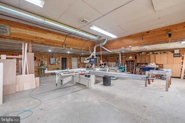 interior space featuring a workshop area and visible vents