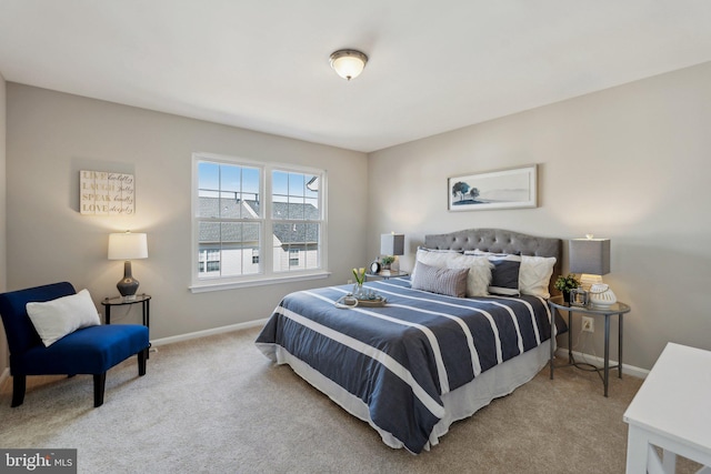 carpeted bedroom featuring baseboards