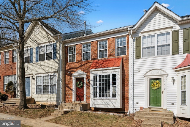 view of property with brick siding