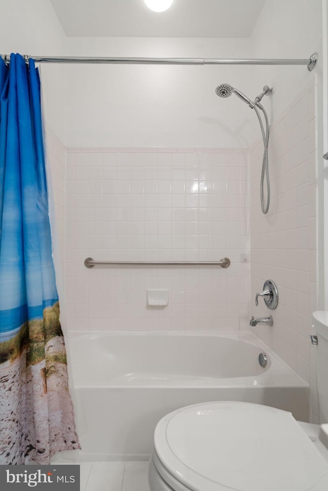 full bathroom with tile patterned flooring, shower / tub combo with curtain, and toilet