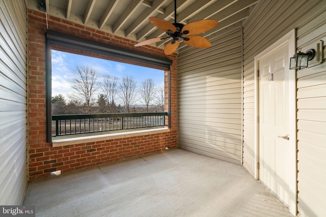 unfurnished sunroom with plenty of natural light and ceiling fan