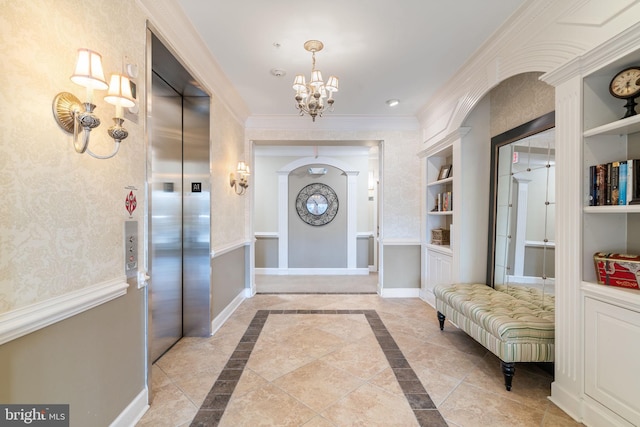 entrance foyer with a notable chandelier, elevator, baseboards, wallpapered walls, and crown molding