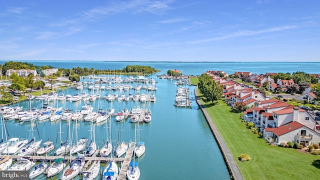 birds eye view of property featuring a water view and a residential view