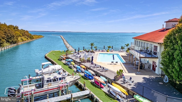 birds eye view of property with a water view