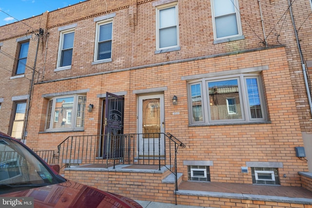 view of front of home with brick siding