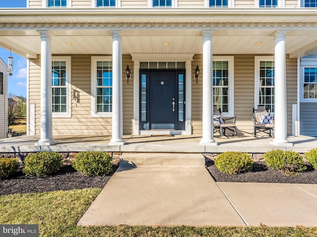 entrance to property featuring a porch