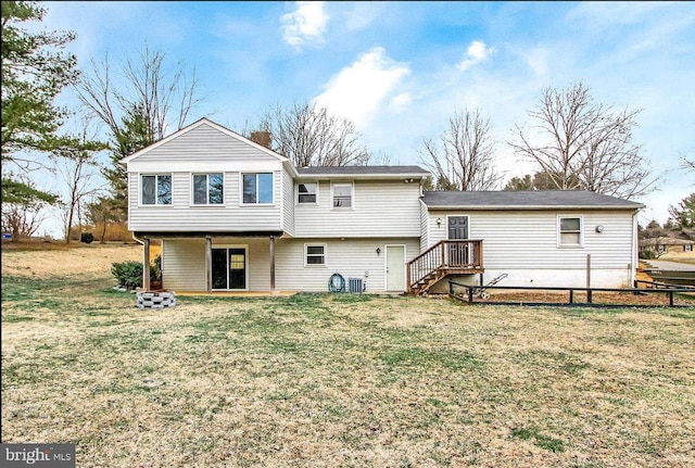 back of house featuring a yard