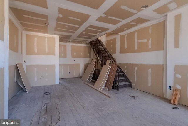 interior space with stairs and wood finished floors