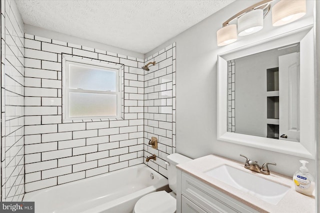 bathroom with shower / bath combination, a textured ceiling, toilet, and vanity