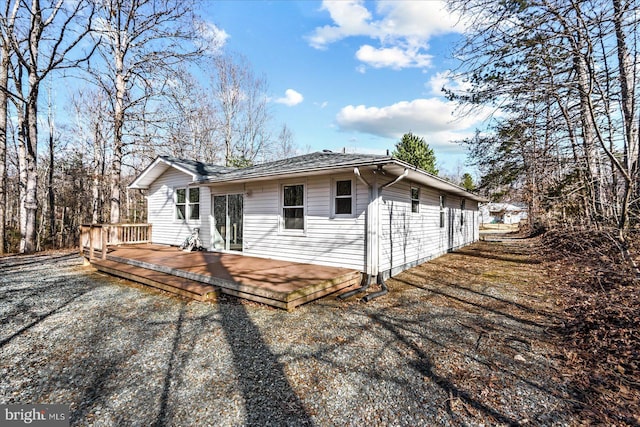 view of home's exterior with a wooden deck