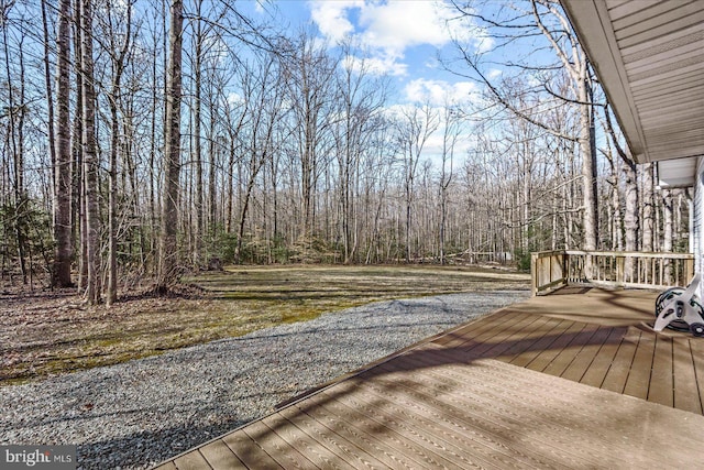 deck featuring a wooded view