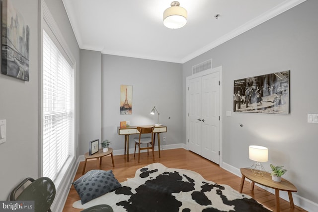 927 12th St NE, Washington, DC 20002 - living area with wood finished floors, visible vents, baseboards, and ornamental molding