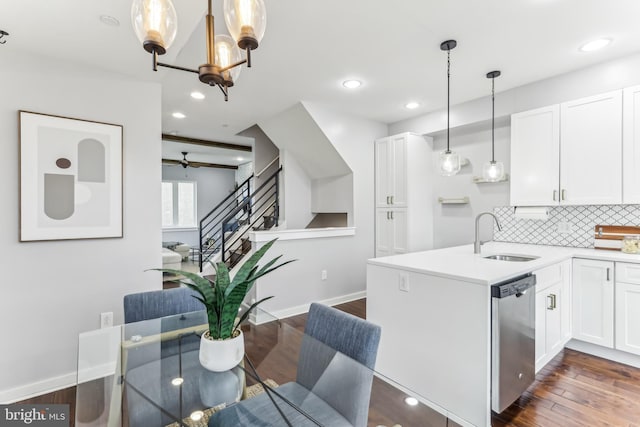 kitchen featuring dark wood-type flooring, white cabinets, a sink, and stainless steel dishwasher