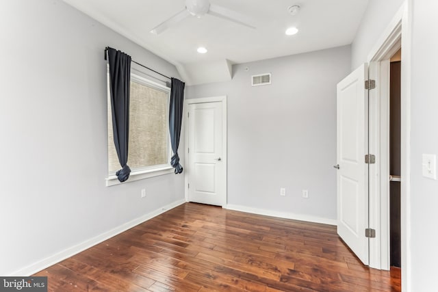 unfurnished bedroom featuring ceiling fan, hardwood / wood-style flooring, recessed lighting, visible vents, and baseboards