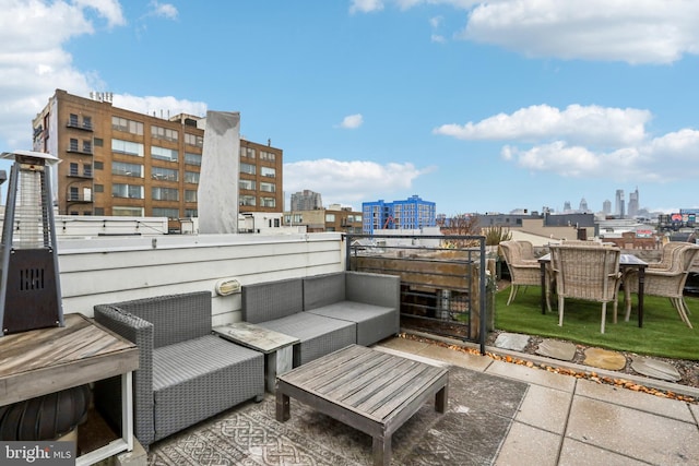 view of patio with a view of city and an outdoor living space