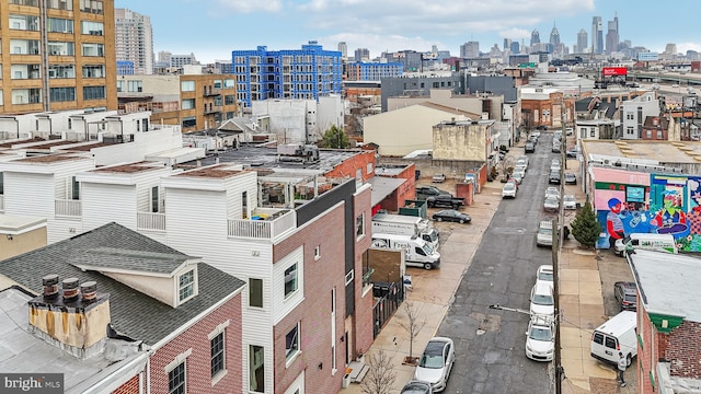 birds eye view of property with a city view