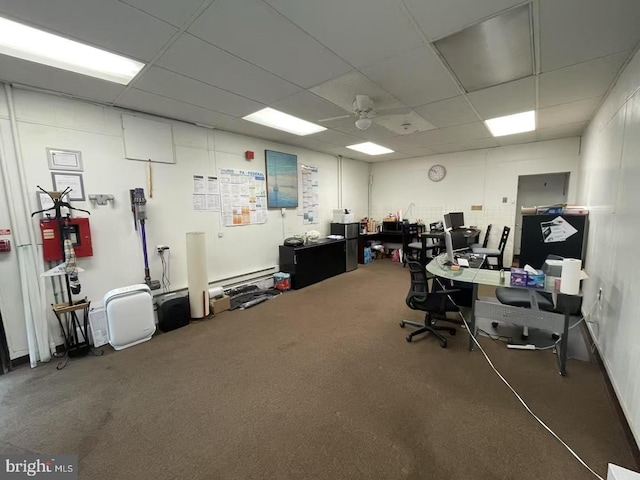 office space featuring ceiling fan and a drop ceiling