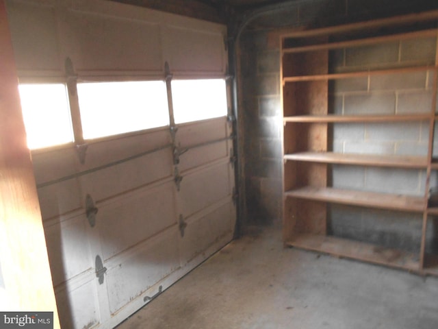 garage with concrete block wall