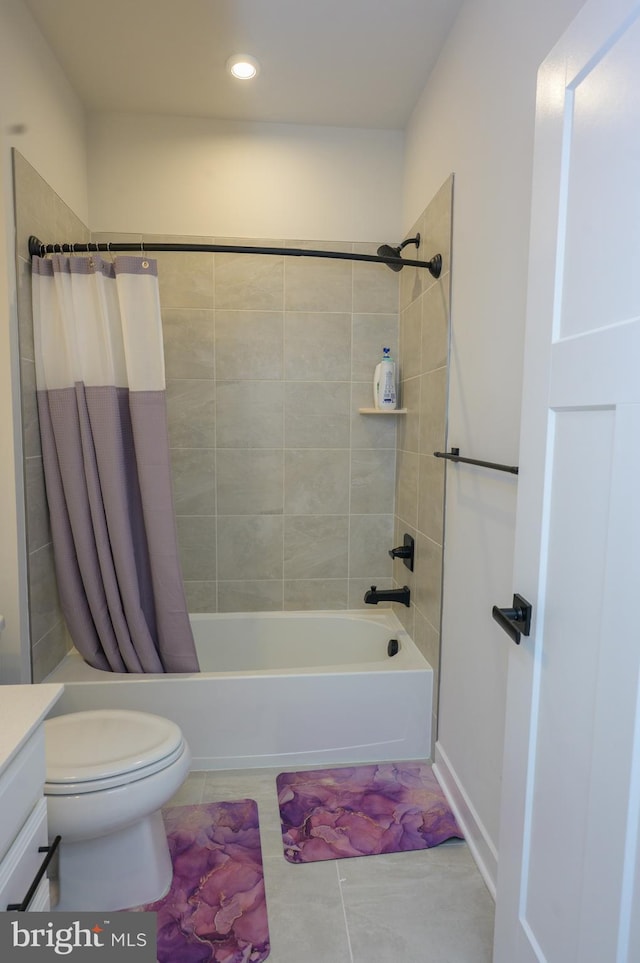 full bathroom with shower / tub combo, vanity, toilet, and tile patterned floors