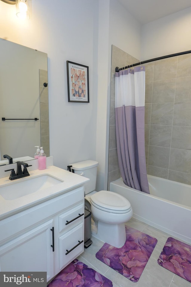 bathroom featuring toilet, tile patterned flooring, shower / bath combo, and vanity