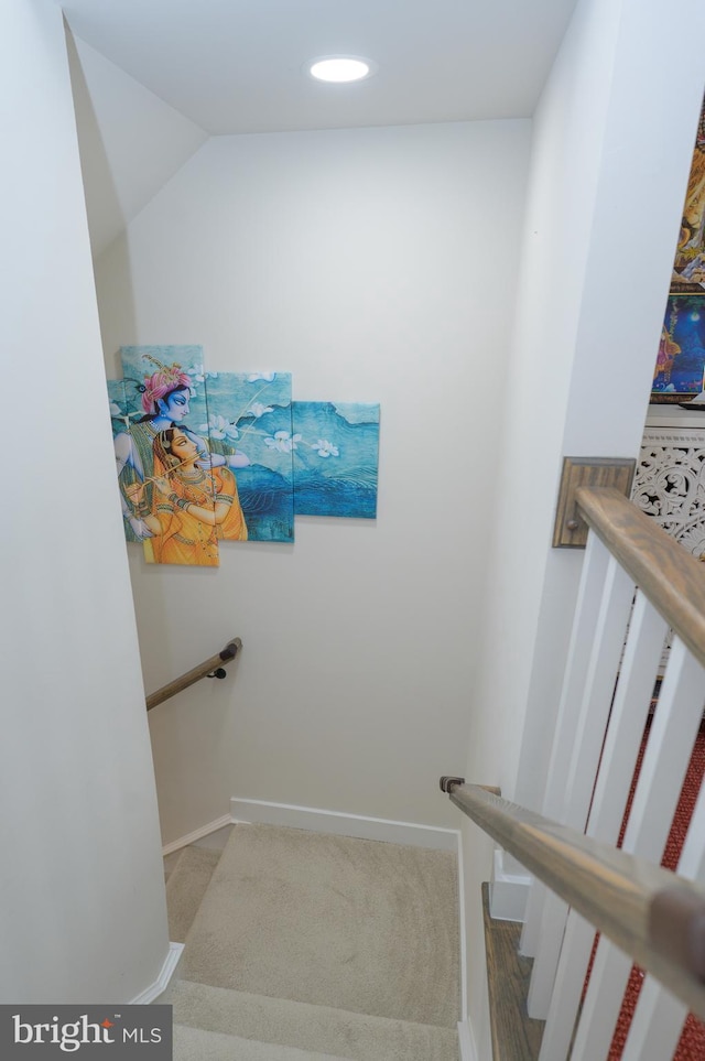 staircase with baseboards and recessed lighting